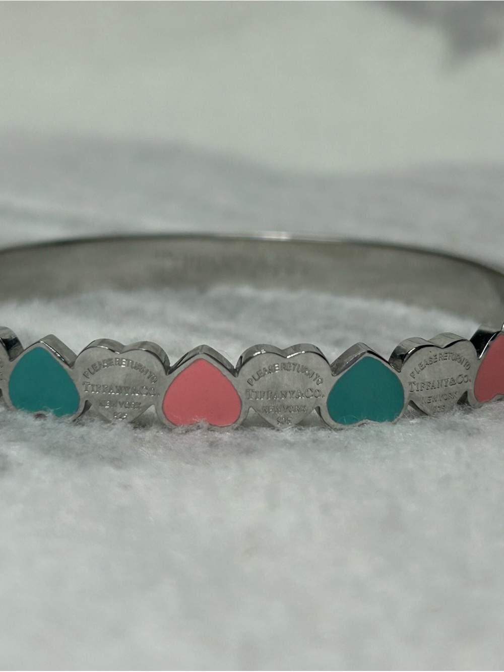 Cute stainless steel blue and pink heart bracelet.